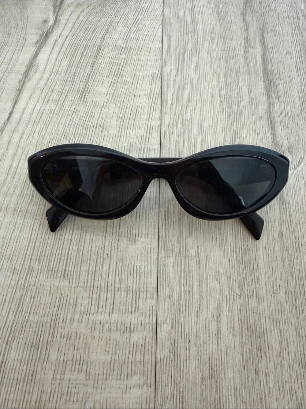 Prada Symbole Black Oval Sunglasses